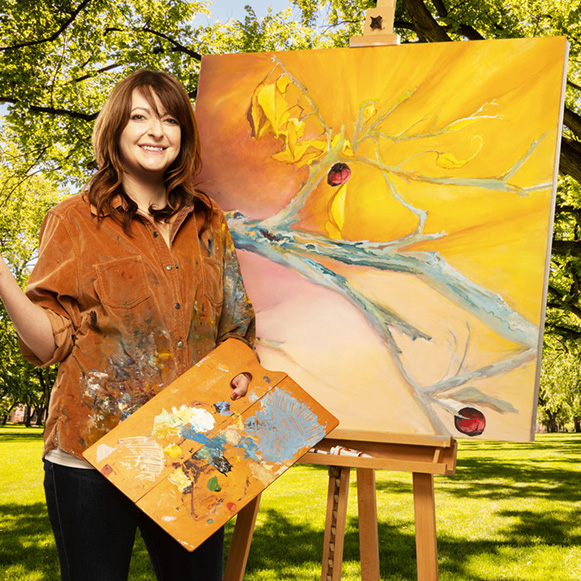 Image of Kerrie Cunningham painting outside